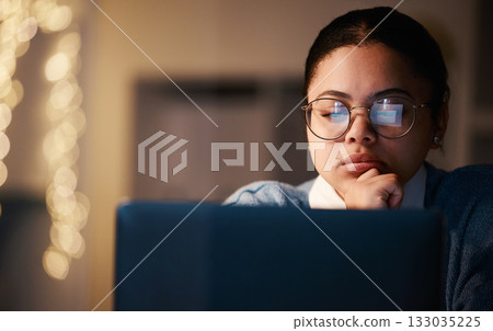 Woman, thinking or reading laptop in night office for growth planning, finance investment or risk management solution. Serious, concentration or working late student on technology with mock up ideas 133035225