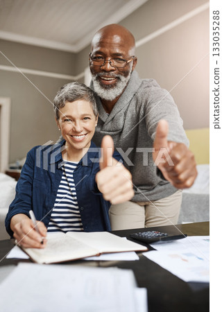 Thumbs up, portrait and senior couple planning, asset management and financial success, winning or thank you. Happy face, finance or interracial people, woman or partner like, yes or ok hands at home Thumbs up, portrait and senior couple planning, asset management and financial success, winning or thank you. Happy face, finance or interracial people, woman or partner like, yes or ok hands at home 133035288