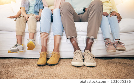 Relax, legs and shoes of black family on sofa for bonding, break and rest together. Support, connection and quality time with parents and children in living room at home for comfort, care and feet 133035386