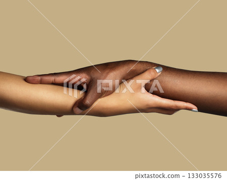 Hands, diversity and support with people in studio on a brown background for unity or solidarity. Team building, partnership and trust with women holding arms in collaboration for help, care or love 133035576
