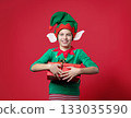 Happy surprise, impression, emotions boy dressed as a Christmas elf holding 133035590
