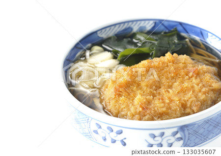 Kakesoba noodles with croquettes on a white background Kakesoba noodles with croquettes on a white background 133035607
