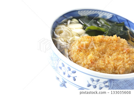 Kakesoba noodles with croquettes on a white background Kakesoba noodles with croquettes on a white background 133035608