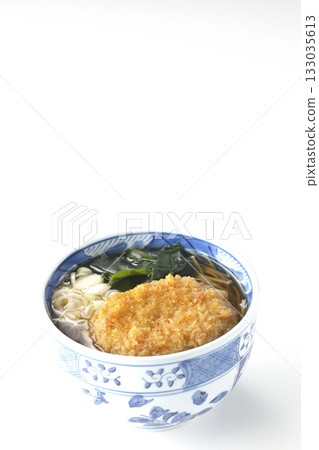 Kakesoba noodles with croquettes on a white background Kakesoba noodles with croquettes on a white background 133035613