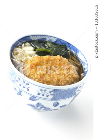 Kakesoba noodles with croquettes on a white background Kakesoba noodles with croquettes on a white background 133035618