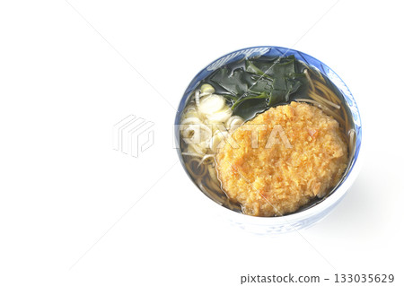 Kakesoba noodles with croquettes on a white background Kakesoba noodles with croquettes on a white background 133035629