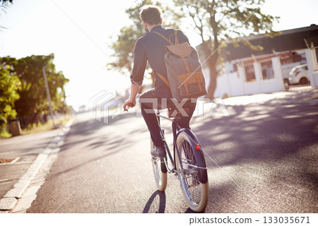 Bicycle, transport and back of man in street on lens flare for exercise, commute and cycling in morning. Travel, city and male cyclist on bike for eco friendly traveling, carbon footprint and journey Bicycle, transport and back of man in street on lens flare for exercise, commute and cycling in morning. Travel, city and male cyclist on bike for eco friendly traveling, carbon footprint and journey 133035671