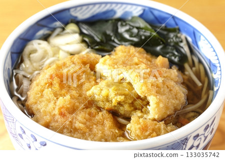 Soba noodles topped with croquettes 133035742