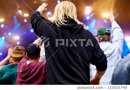 Music, dance and party with crowd at festival for celebration, rave culture and performance. Carnival, summer and techno with audience of people at concert for laser light show, energy and dj event 133035749