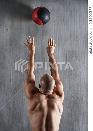 Fitness, wall and man throw medicine ball strength workout, bodybuilding development or gym exercise challenge. Muscle, strong and back of male sports athlete doing bodybuilder training for power Fitness, wall and man throw medicine ball strength workout, bodybuilding development or gym exercise challenge. Muscle, strong and back of male sports athlete doing bodybuilder training for power 133035774