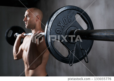 Fitness, man and weightlifting with barbell for training, bodybuilding or arm workout at the gym. Fit, active or strong muscular bodybuilder male lifting weight for intense strength or power exercise 133035776