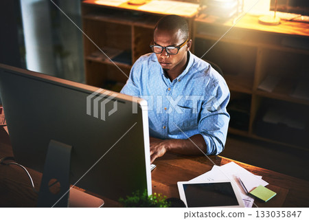 Business man, night developer and computer with office typing and project web research. African male worker, technology and coding for online website management for company with tech and internet Business man, night developer and computer with office typing and project web research. African male worker, technology and coding for online website management for company with tech and internet 133035847