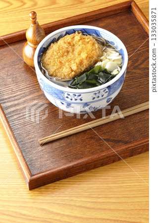 Soba noodles topped with croquettes 133035871