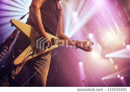 Guitar, man and performance for concert, rock or singing at party, event or celebration in night. Male musician, artist or rockstar with instrument at music festival for art, sound or talent on stage Guitar, man and performance for concert, rock or singing at party, event or celebration in night. Male musician, artist or rockstar with instrument at music festival for art, sound or talent on stage 133035891