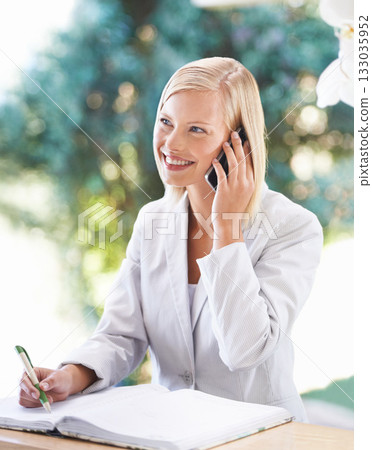 Woman, phone call and receptionist taking notes at desk, smile and speaking to contact. Thinking, notebook and female secretary with cellphone for booking, writing and conversation at hotel. Woman, phone call and receptionist taking notes at desk, smile and speaking to contact. Thinking, notebook and female secretary with cellphone for booking, writing and conversation at hotel. 133035952