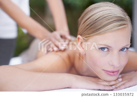 Face, woman in portrait and back massage at spa with holistic treatment and self care. Wellness, young female person relax at luxury resort with masseuse and physical therapy with healing and zen 133035972