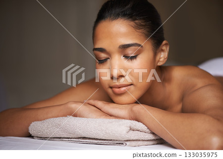 Girl, eyes closed or massage in hotel to relax for zen resting or wellness physical therapy in luxury spa resort. Face of woman sleeping in salon for body healing treatment or natural holistic detox 133035975