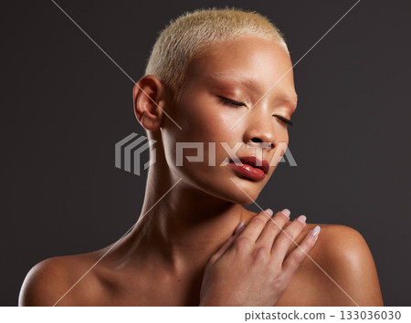 Woman, beauty and skincare makeup for cosmetic treatment against a gray studio background. Beautiful female model touching skin in cosmetics for self love or body care wellness in satisfaction Woman, beauty and skincare makeup for cosmetic treatment against a gray studio background. Beautiful female model touching skin in cosmetics for self love or body care wellness in satisfaction 133036030