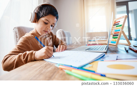 Learning headphones, math education and kid in home with book for studying, homework or homeschool. Development, laptop or boy or child with notebook for numbers in elearning, virtual or online class 133036060