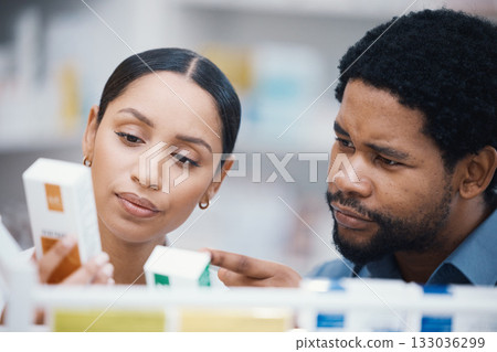 Pharmacist, worker and helping patient with medicine information, pills instructions or medical consulting in store. Pharmacy woman, black man and customer with retail drugs or healthcare product box 133036299