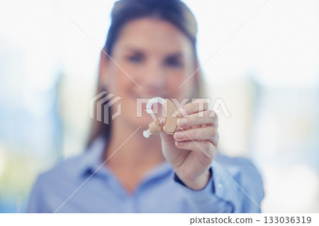 Closeup, woman and ear piece for hearing, healthcare tech and blurry with girl, wellness and help. Female, happy lady and listening device with smile, medical innovation or disability with insurance Closeup, woman and ear piece for hearing, healthcare tech and blurry with girl, wellness and help. Female, happy lady and listening device with smile, medical innovation or disability with insurance 133036319