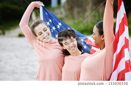 Volleyball woman, team and american flag at beach, happiness and pride for celebration, winning or goal. Women, sports and diversity with support, solidarity or teamwork for winner with excited smile Volleyball woman, team and american flag at beach, happiness and pride for celebration, winning or goal. Women, sports and diversity with support, solidarity or teamwork for winner with excited smile 133036338