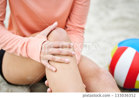Knee pain, woman hands and beach volleyball injury of a athlete on sand with sport accident. Fitness, exercise and training bruise by the sea and ocean with muscle strain from workout and running Knee pain, woman hands and beach volleyball injury of a athlete on sand with sport accident. Fitness, exercise and training bruise by the sea and ocean with muscle strain from workout and running 133036352