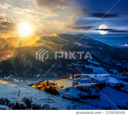 mountain rural area near peaks in snow on frosty winter. day and night time change concept. countryside landscape with sun and moon at twilight. cold alpine climate. duality and transition template 133036369