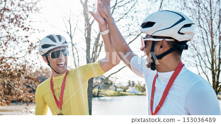 Cycling men or friends high five for sports winning, marathon travel award and countryside competition or race success. Winner athlete or people in teamwork, triathlon journey goals and support hands Cycling men or friends high five for sports winning, marathon travel award and countryside competition or race success. Winner athlete or people in teamwork, triathlon journey goals and support hands 133036489