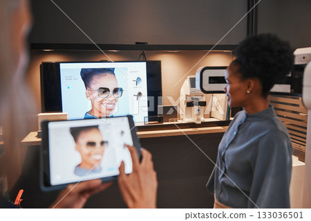Optometry, frames and black woman trying glasses for eye care, vision and choice of sunglasses. Happy, testing and African customer looking at her face with different eyeglasses for the best fit 133036501