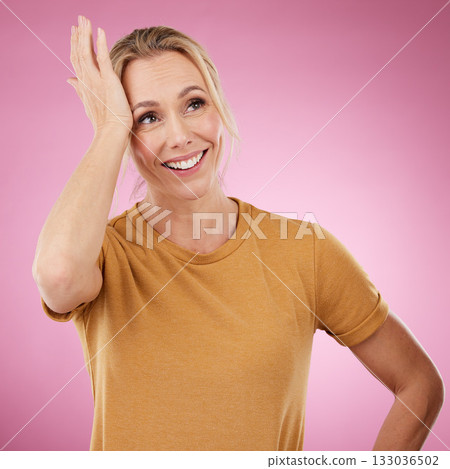 Thinking, wow and eureka with a woman in studio on a pink background contemplating a thought. Idea, omg and lightbulb moment with an attractive mature female in contemplation against a pastel wall 133036502