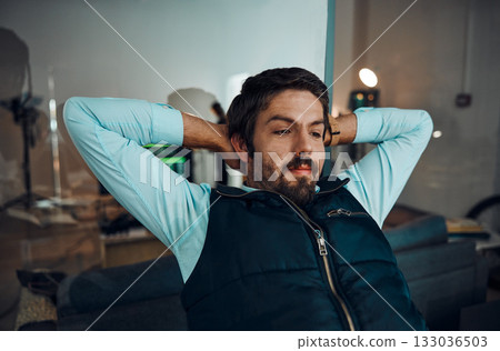 Relax, break and man in an office for work, success and working at night for a deadline. Looking, corporate and businessman with stress relief, relaxed and overtime in the workplace in the dark 133036503