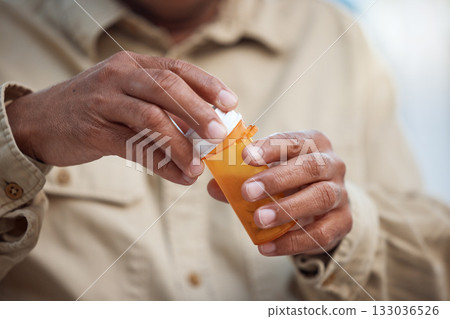 Medication, healthcare and male hands with pills for recovery, wellness and health in his home. Medicine, medical emergency and mature man taking tablets for a flu, cold or sickness in his house. Medication, healthcare and male hands with pills for recovery, wellness and health in his home. Medicine, medical emergency and mature man taking tablets for a flu, cold or sickness in his house. 133036526