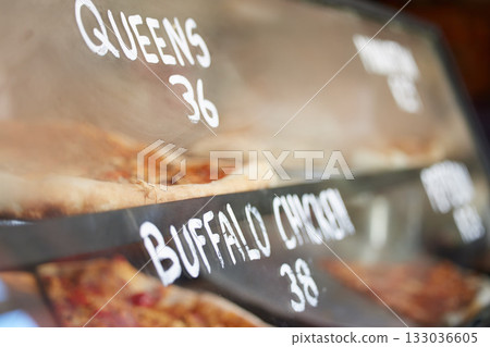 Shop display, pizza and fast food price, service and take away restaurant with closeup, storefront and window. Dinner, nutrition at cafe or bakery, lunch or dinner with to go meal option in New York Shop display, pizza and fast food price, service and take away restaurant with closeup, storefront and window. Dinner, nutrition at cafe or bakery, lunch or dinner with to go meal option in New York 133036605