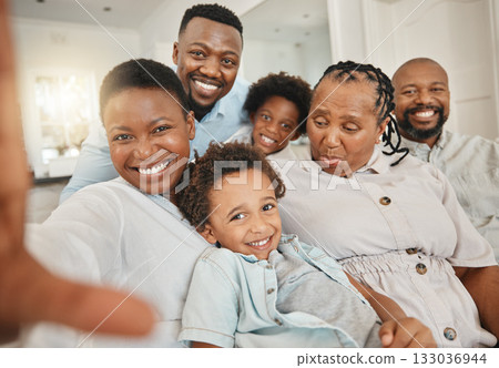 Black family, selfie and living room sofa with a mother, children and grandma together. Love, portrait and bonding of a mom, father and kids with senior woman in a house with a smile on a couch 133036944