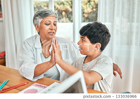 Learning, high five and child knowledge development at home with grandparent teacher. Teaching, elderly woman help and homework achievement hand gesture of a senior person and kid at a house Learning, high five and child knowledge development at home with grandparent teacher. Teaching, elderly woman help and homework achievement hand gesture of a senior person and kid at a house 133036966