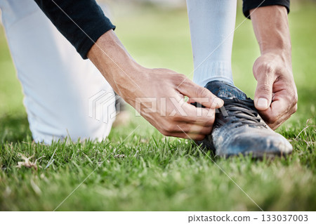 Closeup, fitness and man tie shoe, hands and exercise for wellness, healthy lifestyle and on field. Zoom, male athlete and player with shoelace, training or workout for balance, sports or competition 133037003