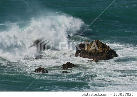 Rough waves hit the rocky shores of Irako Rough waves hit the rocky shores of Irako 133037025