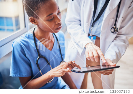 Tablet, black woman or doctors planning surgery in conversation about medical news or tests results in hospital. Teamwork, digital or nurses speaking of online healthcare report or website research 133037153