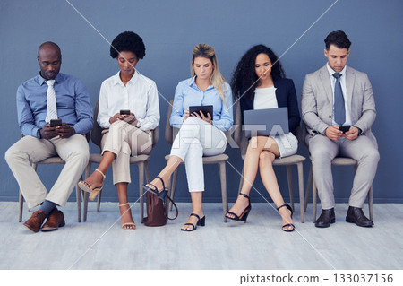 HR, technology and business people waiting in line for an interview during the recruitment process. Resume, diversity or hiring with a man and woman employee group sitting in a human resources row 133037156