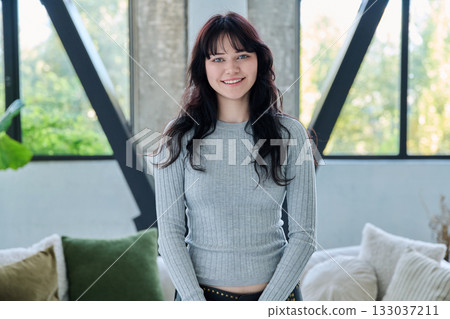 Portrait of young happy woman posing in home 133037211