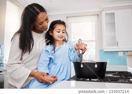 Cooking, food and happy with mother and daughter in kitchen for learning, bonding and meal preparation. Smile, health and nutrition with woman and girl in family home for teaching, diet and culinary 133037214