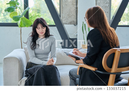 Psychology session for young female patient, professional help and support 133037215