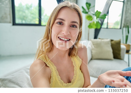 Close-up selfie portrait of teenage female looking at web camera Close-up selfie portrait of teenage female looking at web camera 133037250