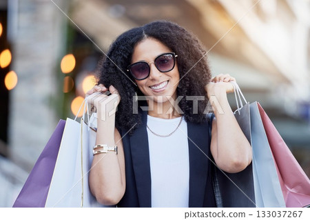 Portrait, shopping and black woman with bags at a mall, happy and excited for sale. Face, fashion and girl with relax with luxury, purchase while walking outdoors, satisfied and cheerful on weekend Portrait, shopping and black woman with bags at a mall, happy and excited for sale. Face, fashion and girl with relax with luxury, purchase while walking outdoors, satisfied and cheerful on weekend 133037267