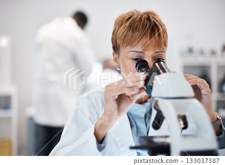 Check, microscope and science with black woman in laboratory for experiment, medical and pharmacy. Healthcare, medicine and results with expert looking for pathology, test and sample analysis Check, microscope and science with black woman in laboratory for experiment, medical and pharmacy. Healthcare, medicine and results with expert looking for pathology, test and sample analysis 133037387