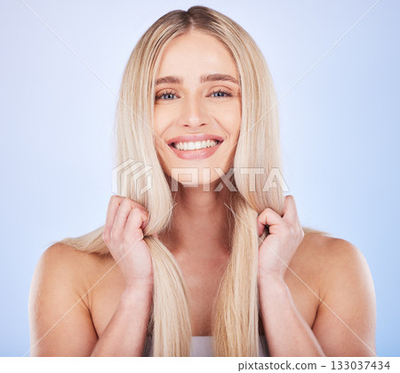 Face portrait, hair care and beauty of woman in studio isolated on a blue background. Cosmetics, keratin and happy young female model with salon treatment for hairstyle, blonde balayage and growth. Face portrait, hair care and beauty of woman in studio isolated on a blue background. Cosmetics, keratin and happy young female model with salon treatment for hairstyle, blonde balayage and growth. 133037434