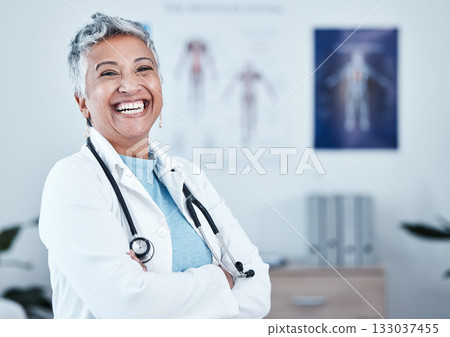 Happy, portrait and elderly woman doctor proud in hospital, excited and laugh for healthcare innovation. Face, elderly and female health expert smile for medical, mission or ready to help at clinic Happy, portrait and elderly woman doctor proud in hospital, excited and laugh for healthcare innovation. Face, elderly and female health expert smile for medical, mission or ready to help at clinic 133037455