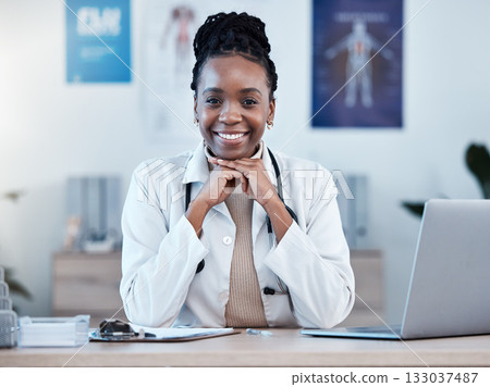 Black woman, doctor in portrait and health, smile in office and laptop, medical professional and happy in career. Female physician, hands and healthcare mindset with cardiologist at clinic and leader Black woman, doctor in portrait and health, smile in office and laptop, medical professional and happy in career. Female physician, hands and healthcare mindset with cardiologist at clinic and leader 133037487