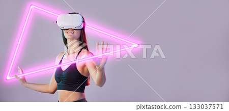 Hologram, vr or happy woman in metaverse on studio background gaming, cyber on digital overlay. Wow, pink triangle or virtual reality user or fantasy girl gamer in futuristic 3d ai scifi experience 133037571